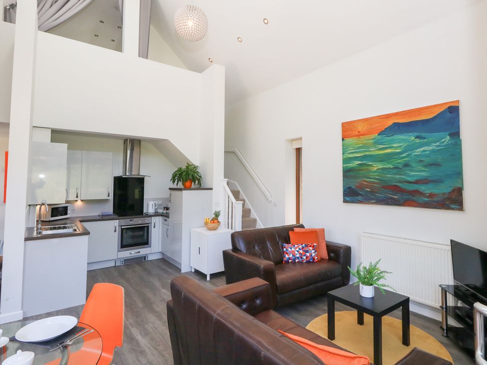 A living room with a sofa and coffee table at Shepherd Oak in Upwey near Weymouth