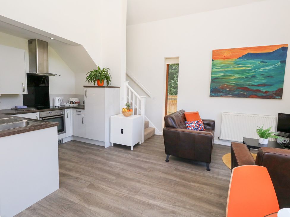 A kitchen and living area with furniture at Shepherd Oak Upwey near Weymouth