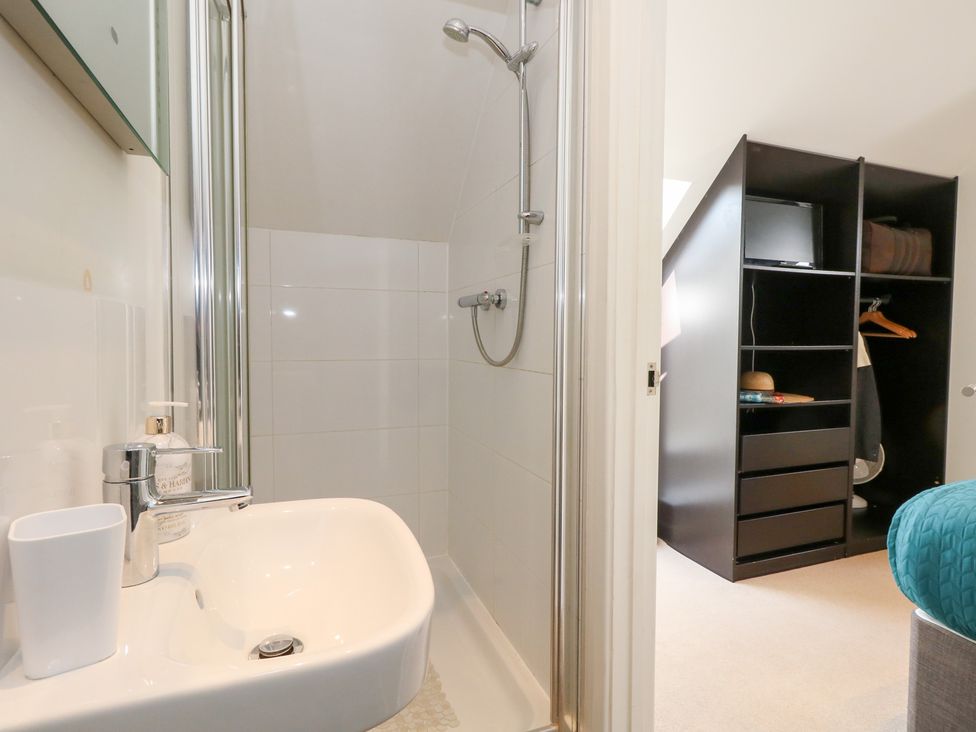 A bathroom with shower and sink at Shepherd Oak in Upwey near Weymouth