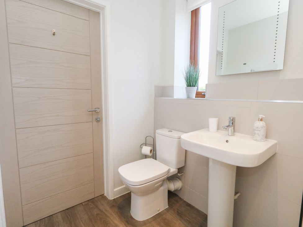 A bathroom with a sink and toilet at Shepherd Oak Upwey near Weymouth