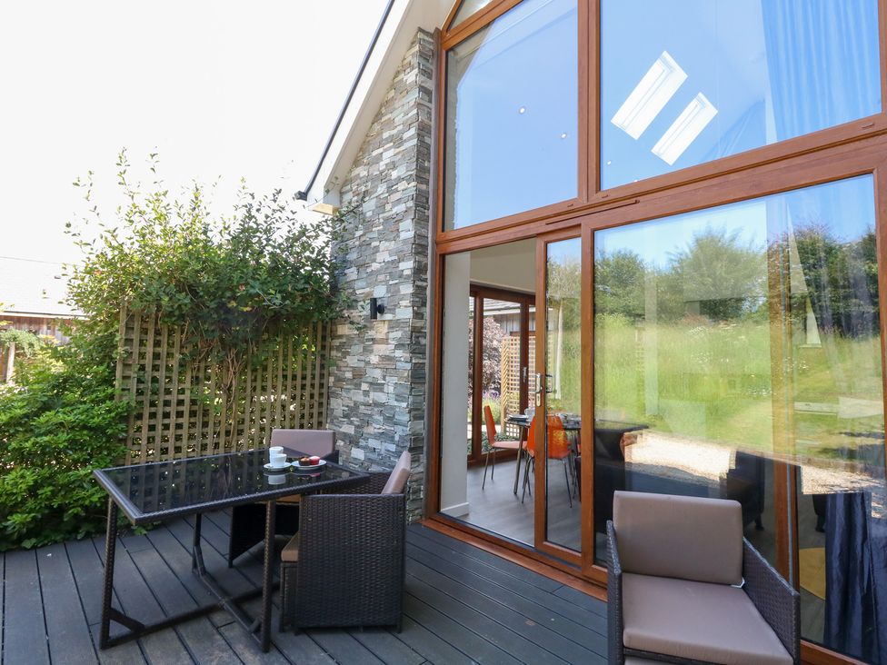 An outdoor space with a table and chairs at Shepherd Oak in Upwey near Weymouth