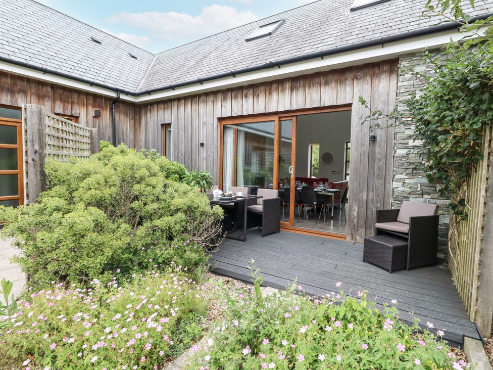 A garden area with seating and plants at Everdene Upwey near Weymouth