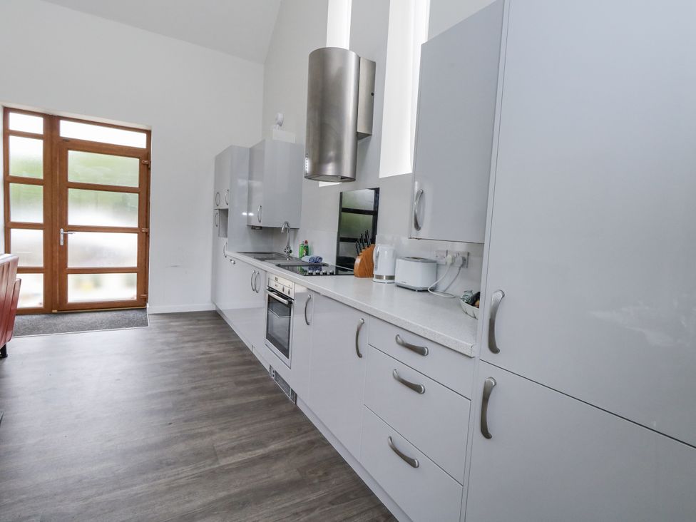 A kitchen with cabinets and appliances at Everdene Upwey near Weymouth
