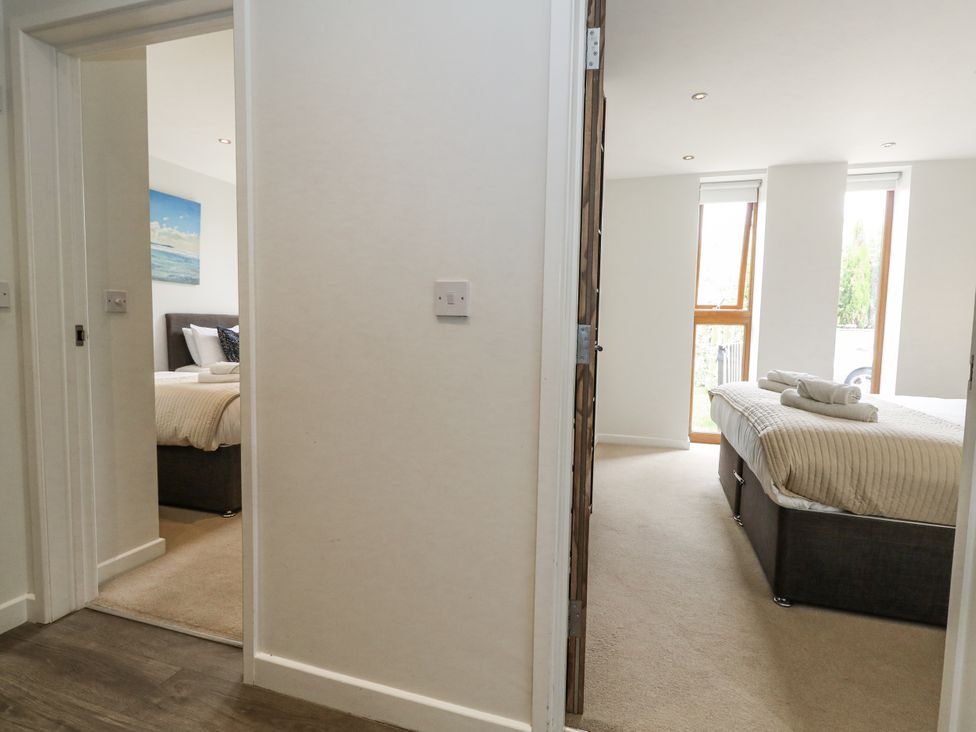 A hallway view of two bedrooms at Everdene in Upwey near Weymouth