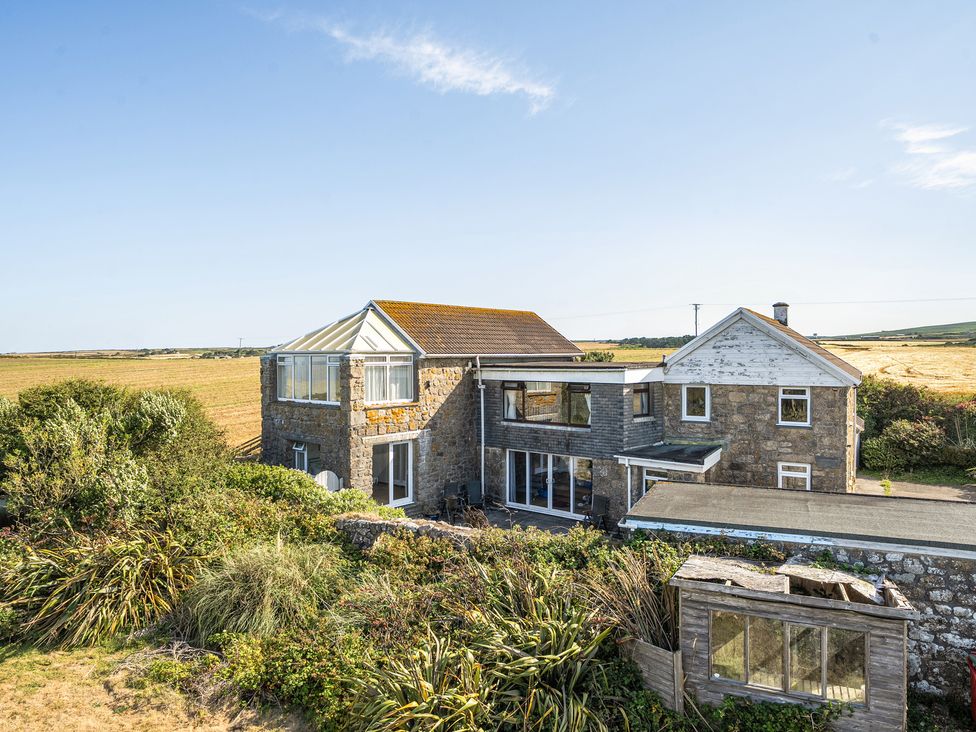 An exterior view of a house with a garden at Tregiffian Vean Sennen Cove