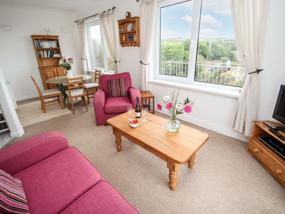 A living room with a coffee table and sofa at The Lookout in Sennen