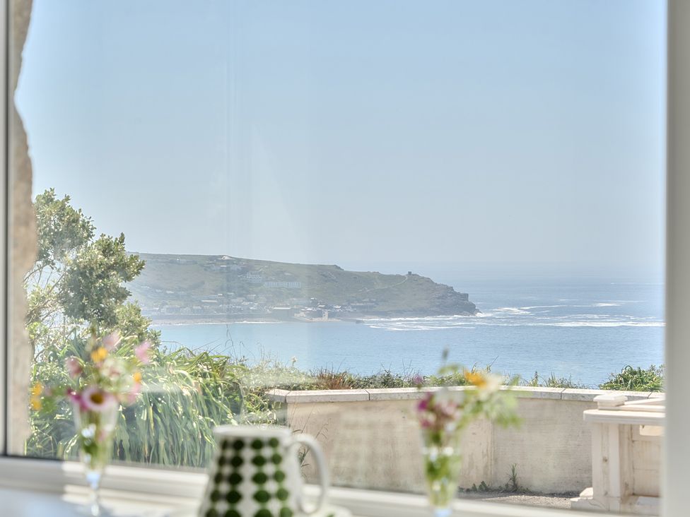 A coastal view from a living room window at Brook House in Sennen Cove near St Just