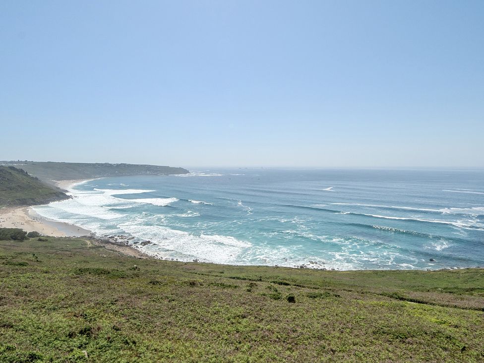 A beach view with ocean waves at Brook House Sennen Cove near St Just