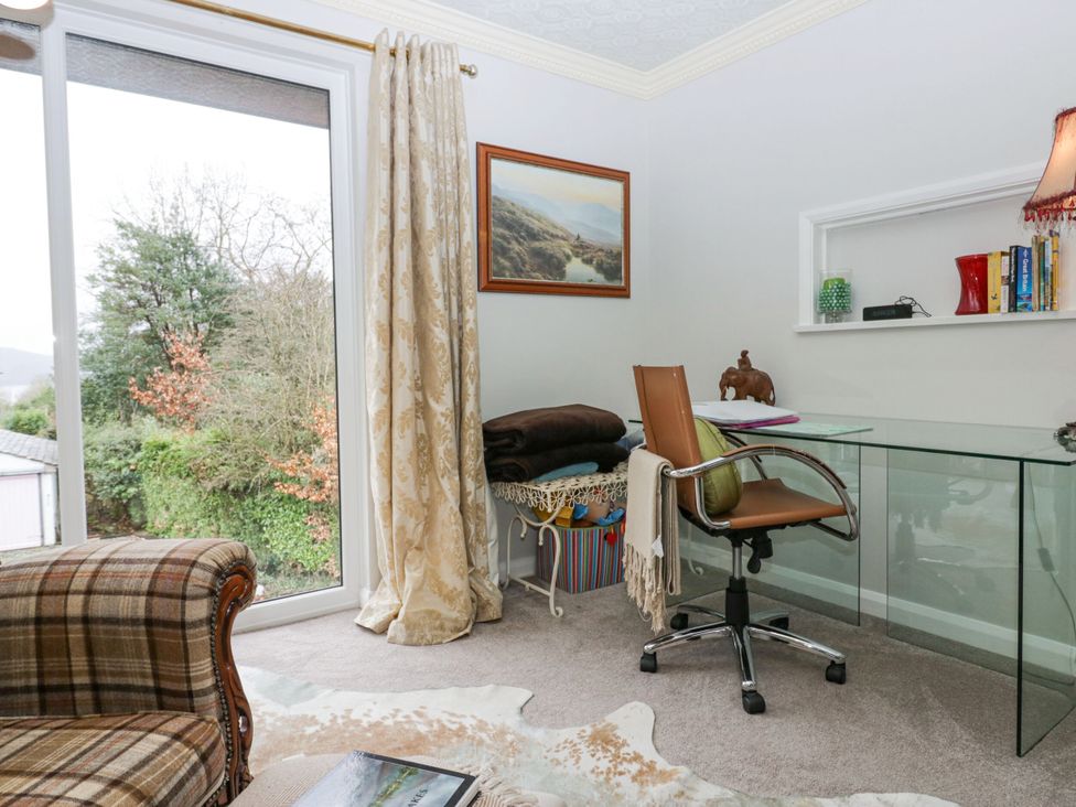 An office with a desk, chair, and window at Kempton in Bowness-on-Windermere