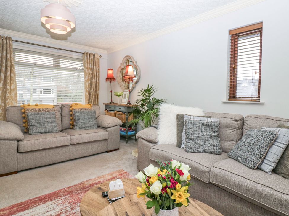 A living room with sofas and a coffee table at Kempton in Bowness-on-Windermere