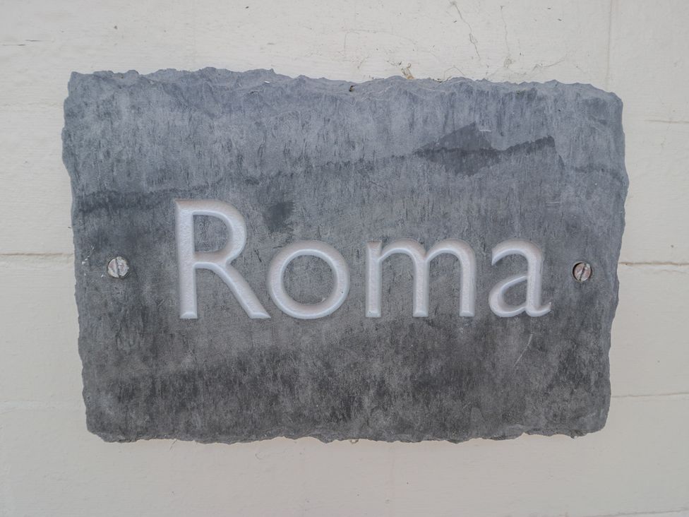 A plaque with the text Roma at Roma in Rhos-on-Sea
