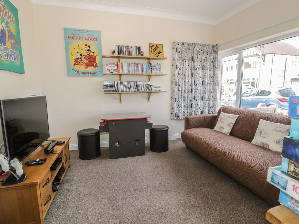 A living room with a sofa and television at Roma in Rhos-on-Sea