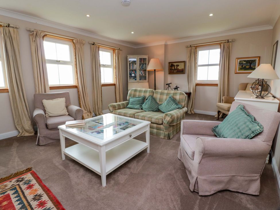A living room with sofa and coffee table at Little Laight in Cairnryan near Stranraer