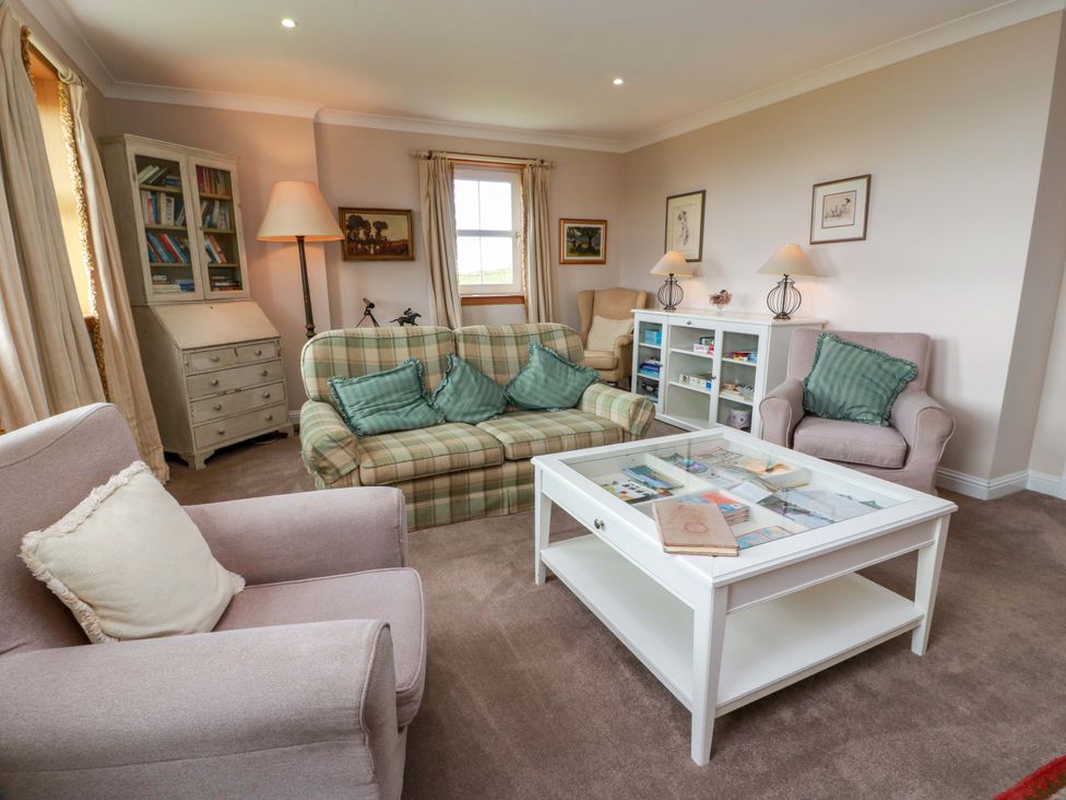 A living room with a sofa and coffee table at Little Laight in Cairnryan near Stranraer