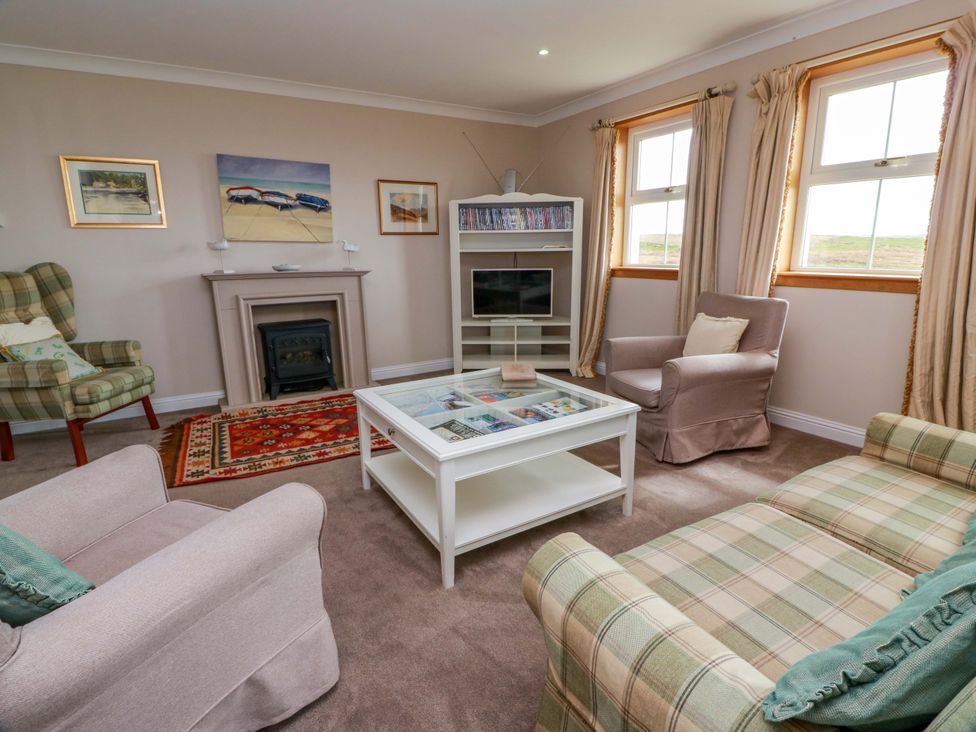 A living room with seating and a television at Little Laight in Cairnryan near Stranraer