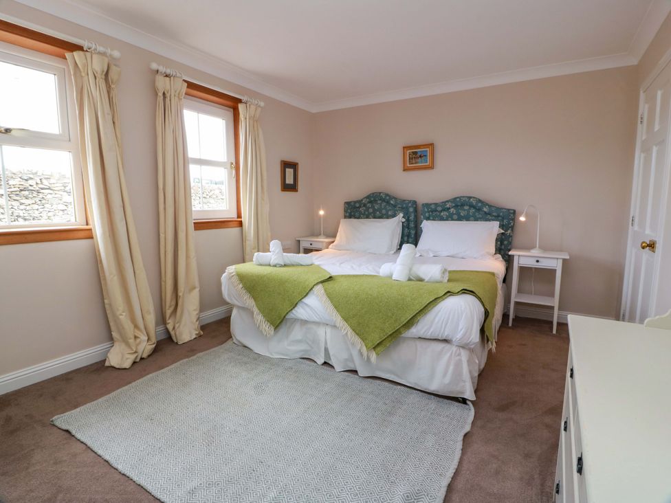 A bedroom with a bed and bedside tables at Little Laight Cairnryan near Stranraer