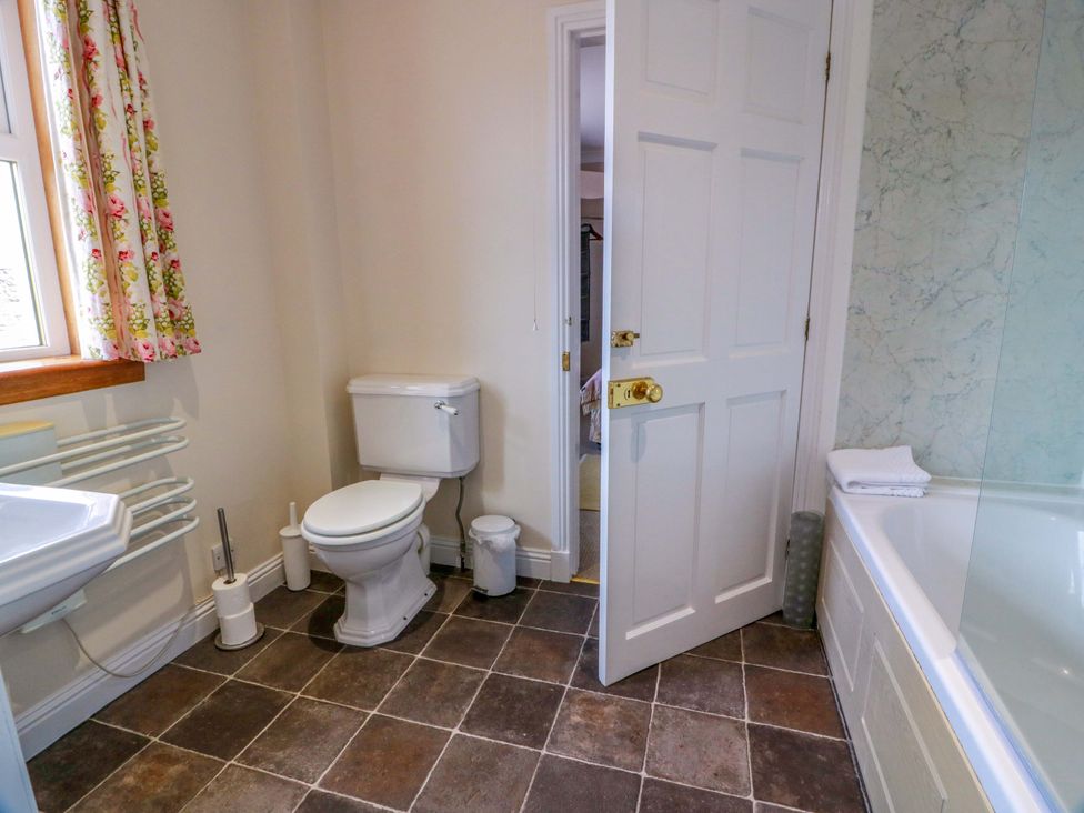 A bathroom with a toilet, sink, and bathtub at Little Laight in Cairnryan near Stranraer