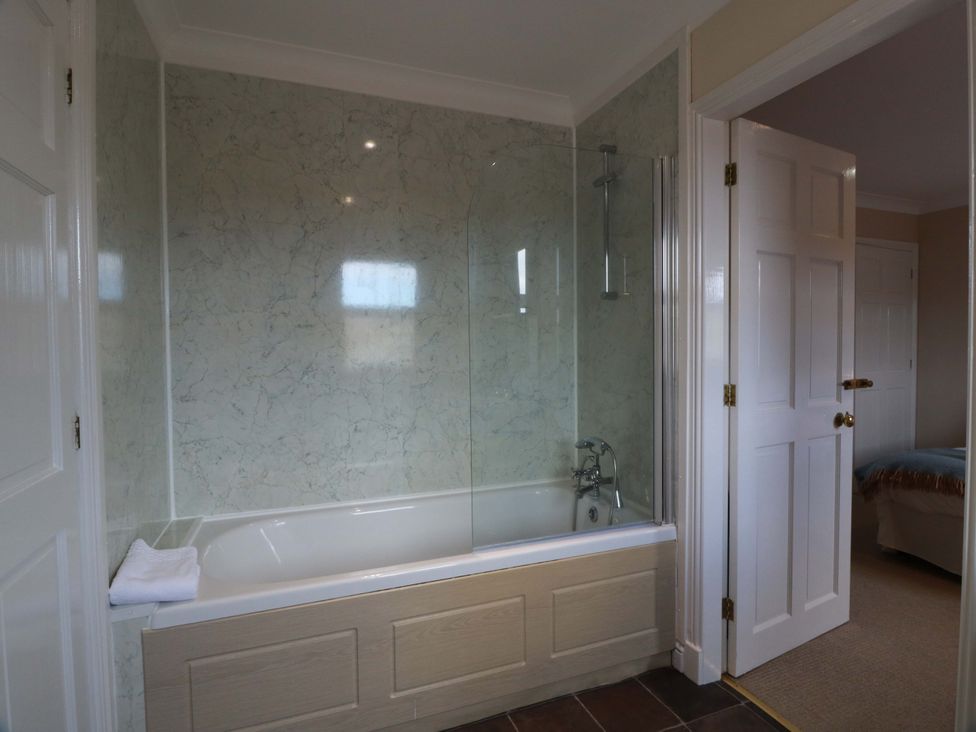 A bathroom with a bathtub and shower at Little Laight Cairnryan near Stranraer