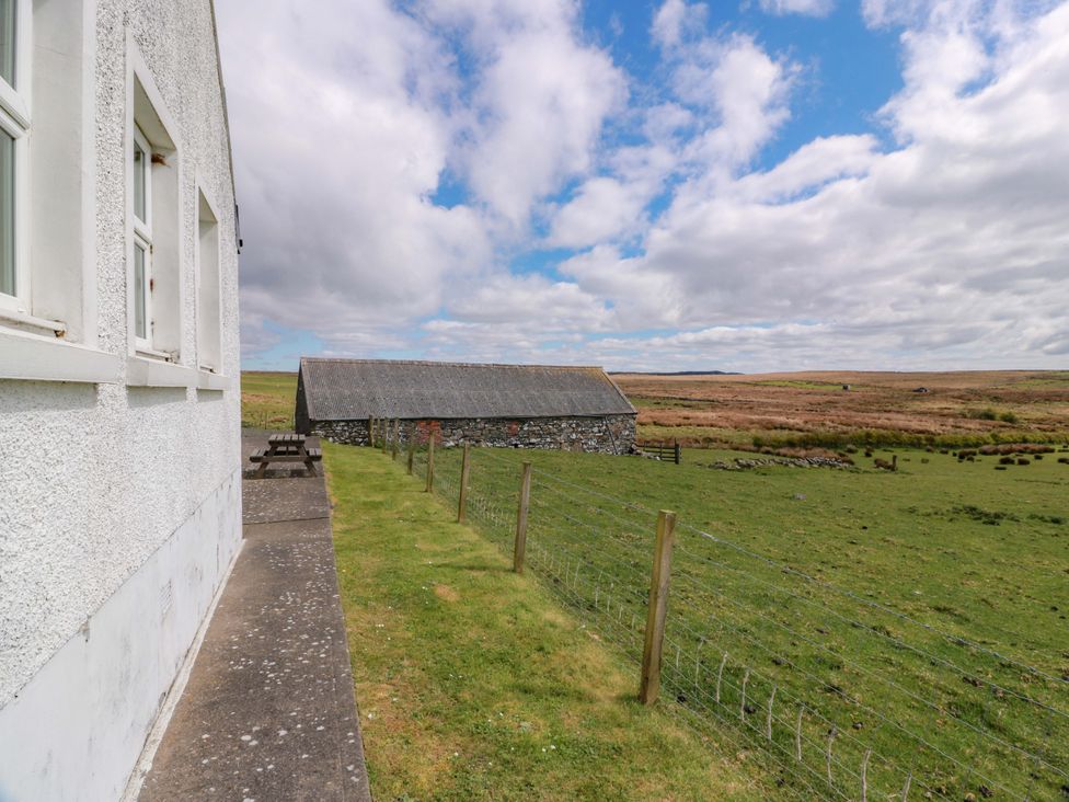 An outdoor view of a barn and grass area at Little Laight Cairnryan near Stranraer