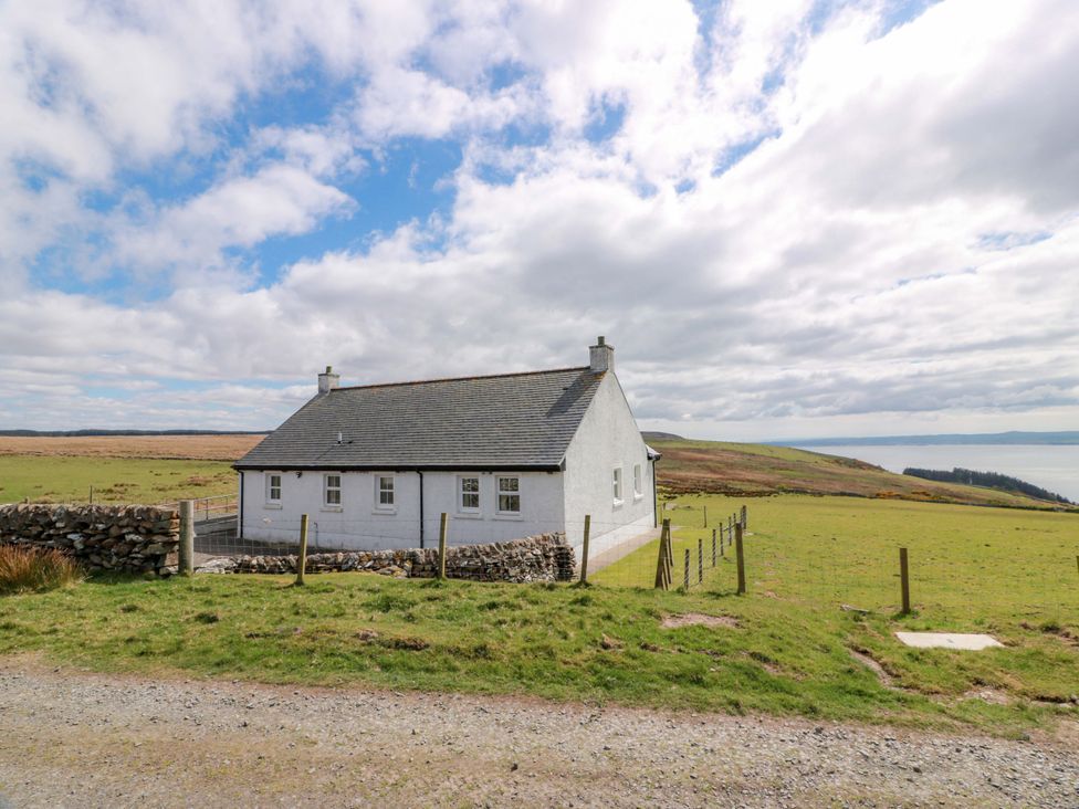 A house surrounded by a fence and field at Little Laight Cairnryan near Stranraer