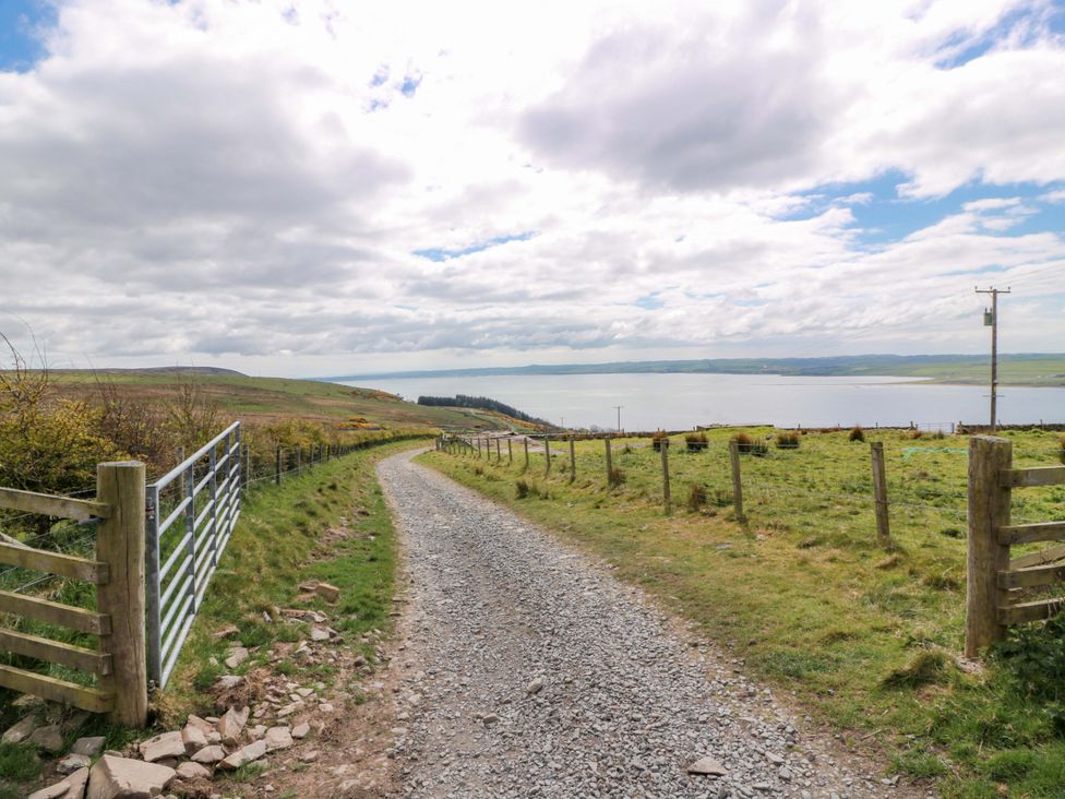 A gravel path leading to a waterbody at Little Laight, Cairnryan near Stranraer