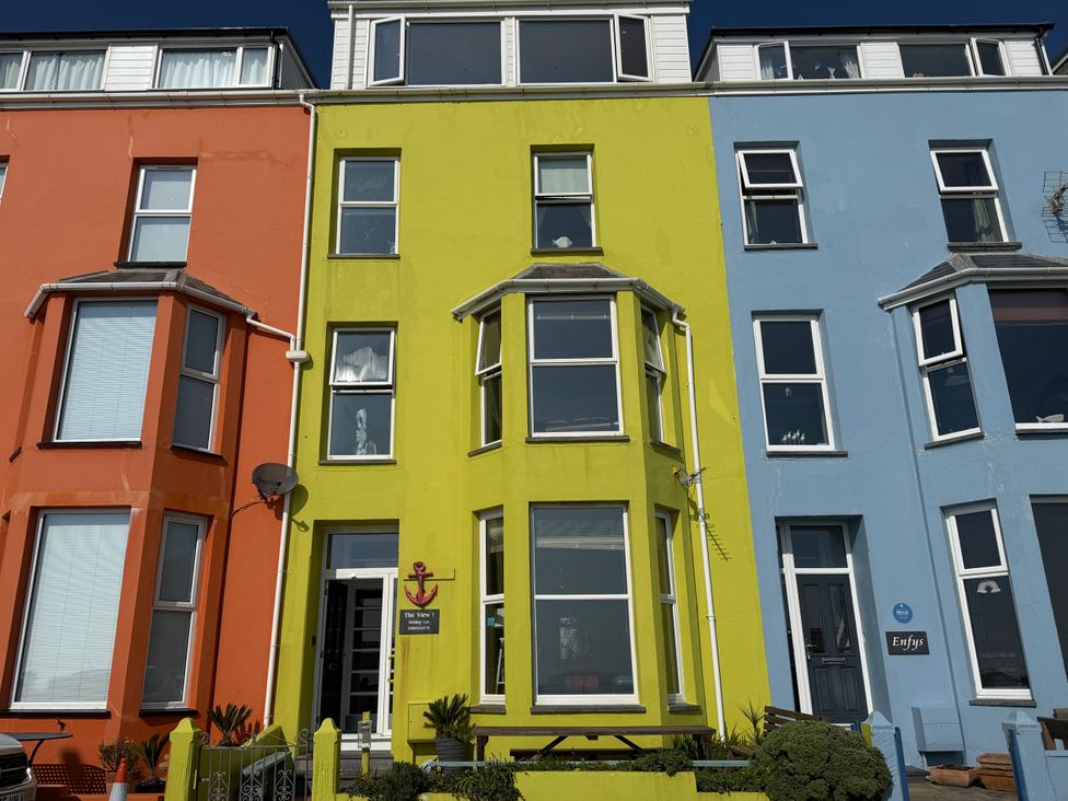 A colorful building with green, orange, and blue walls at The View in Criccieth