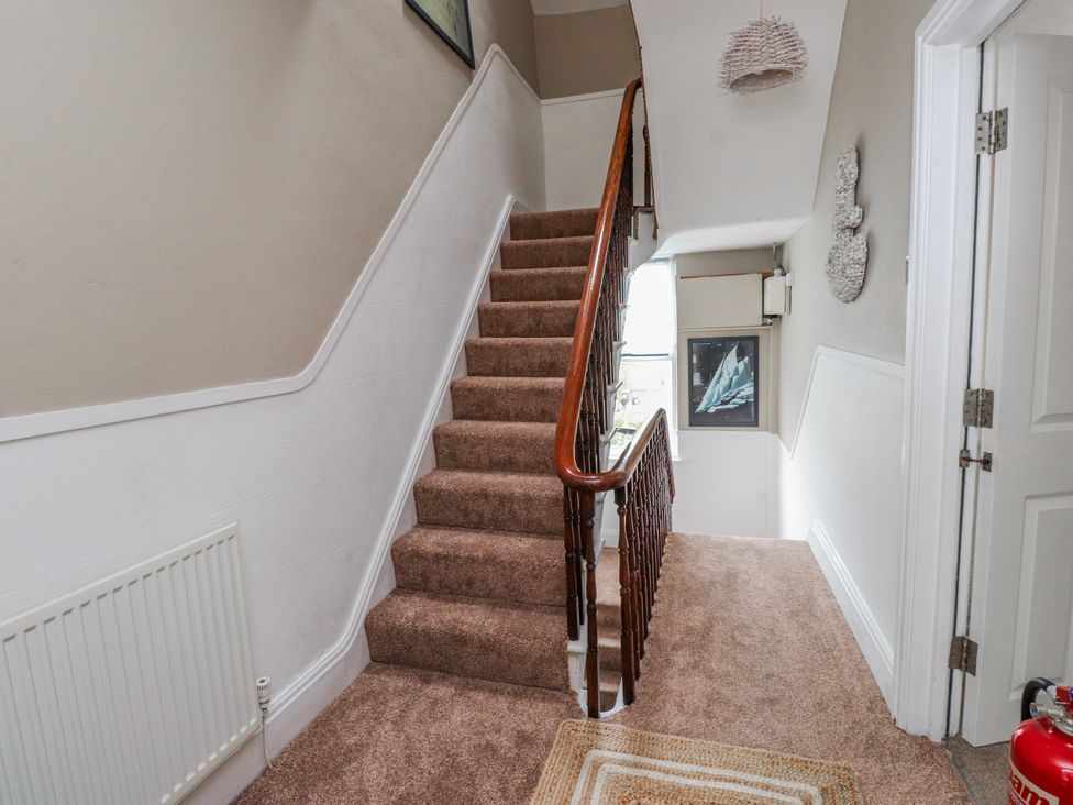 A staircase leading to a hallway at The View Criccieth