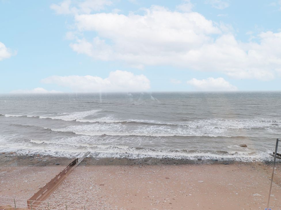 A view of the sea and shore at The View in Criccieth