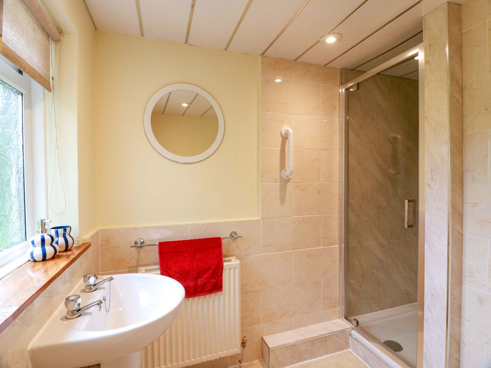 A bathroom with a sink and shower at Camphill in Kirkcudbright