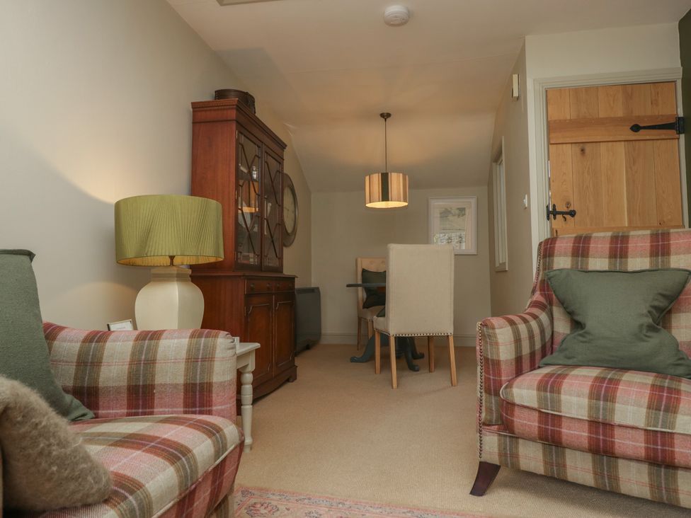 A snug with armchairs and a table at Gable End in Coniston near Hawkshead