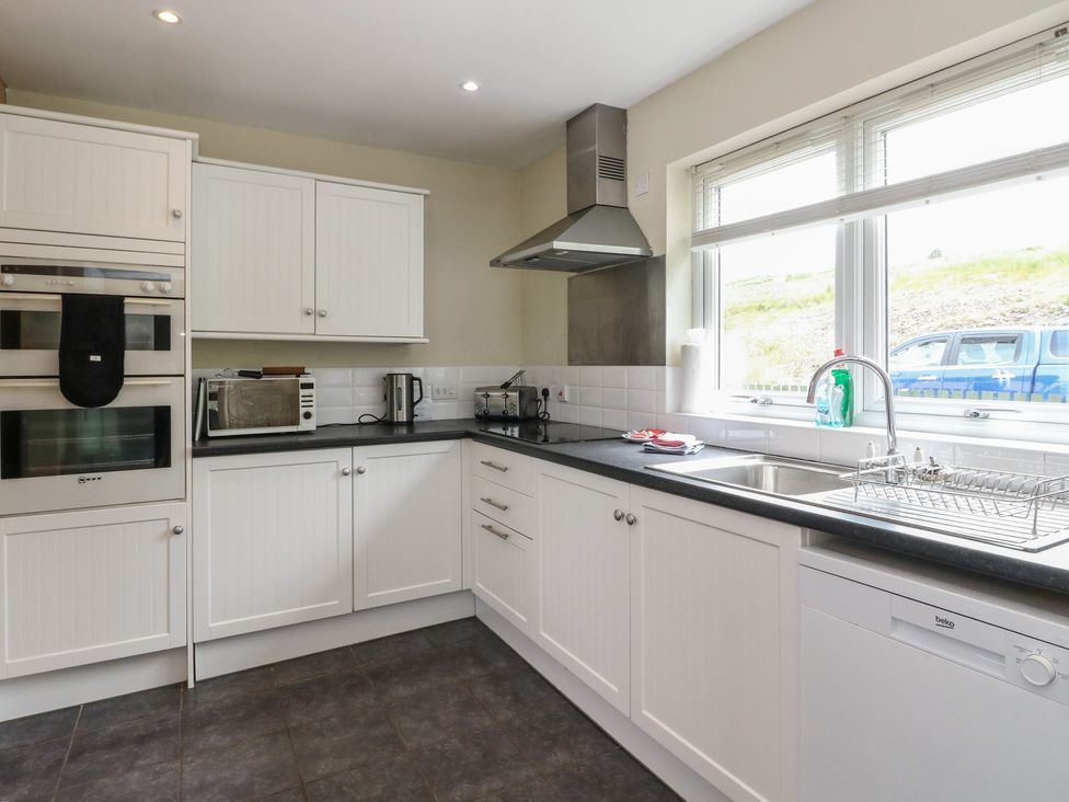 A kitchen with appliances including an oven and microwave at Sunset Cottage Craignure Isle Of Mull