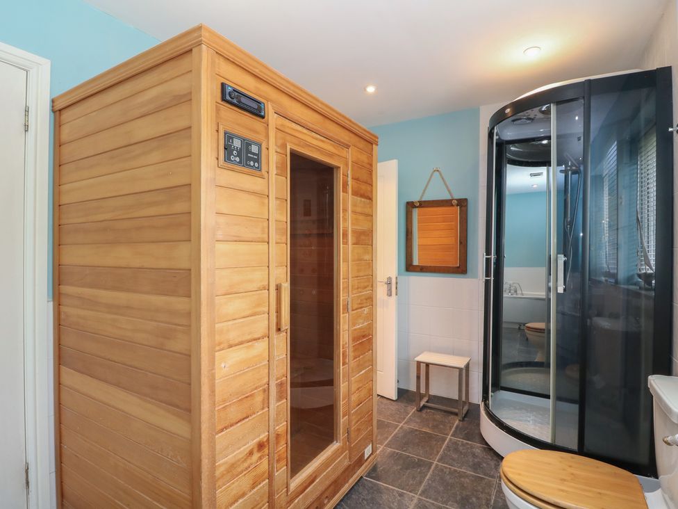 A bathroom with a sauna and shower at Starfish Cottage, Craignure, Isle Of Mull