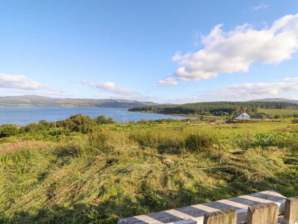 A landscape with water and a house near the shore at Starfish Cottage, Craignure, Isle Of Mull