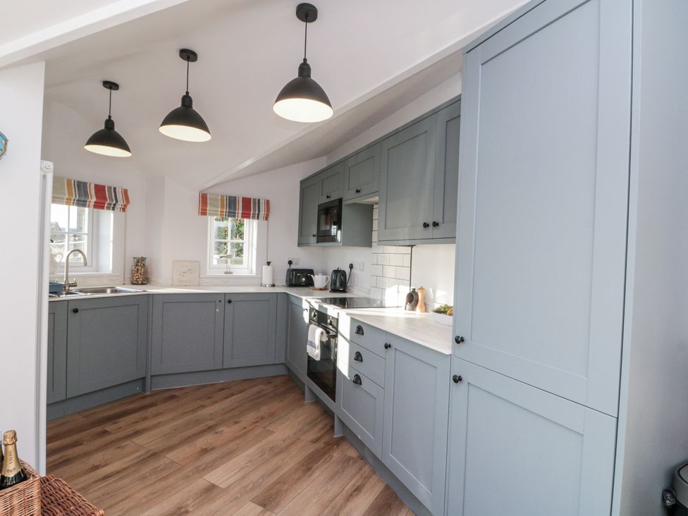 A kitchen with cabinets and appliances at Croft View in Fylingthorpe near Robin Hood's Bay
