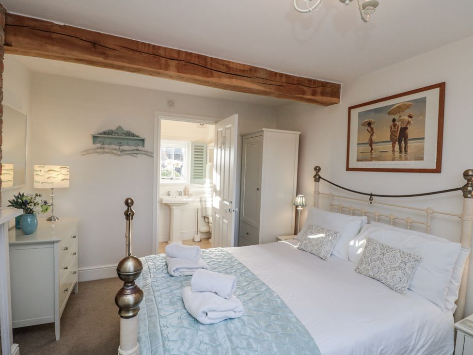 A bedroom with a bed and dresser at Croft View in Fylingthorpe near Robin Hood's Bay