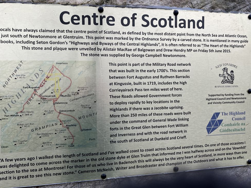 Centre of Scotland information plaque at Wildcat Lodge in Newtonmore