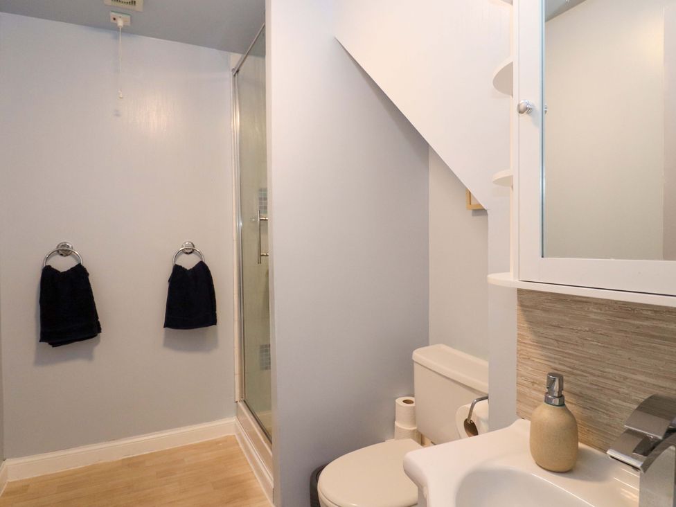 A bathroom with a shower and sink at Ceól na Mara Uig