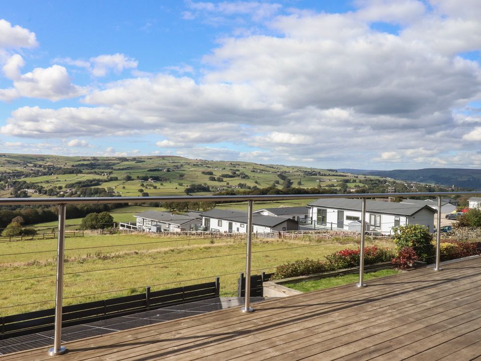 A view of fields and houses from a deck at Heath Hideaway