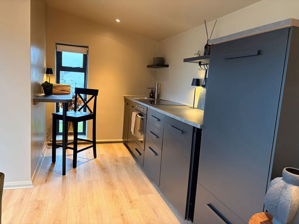 A kitchen with cabinets and a countertop at Heath Hideaway Norland near Ripponden