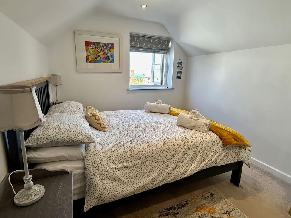 A bedroom with a bed and window at 14 Boscaswell Downs Pendeen near St Just