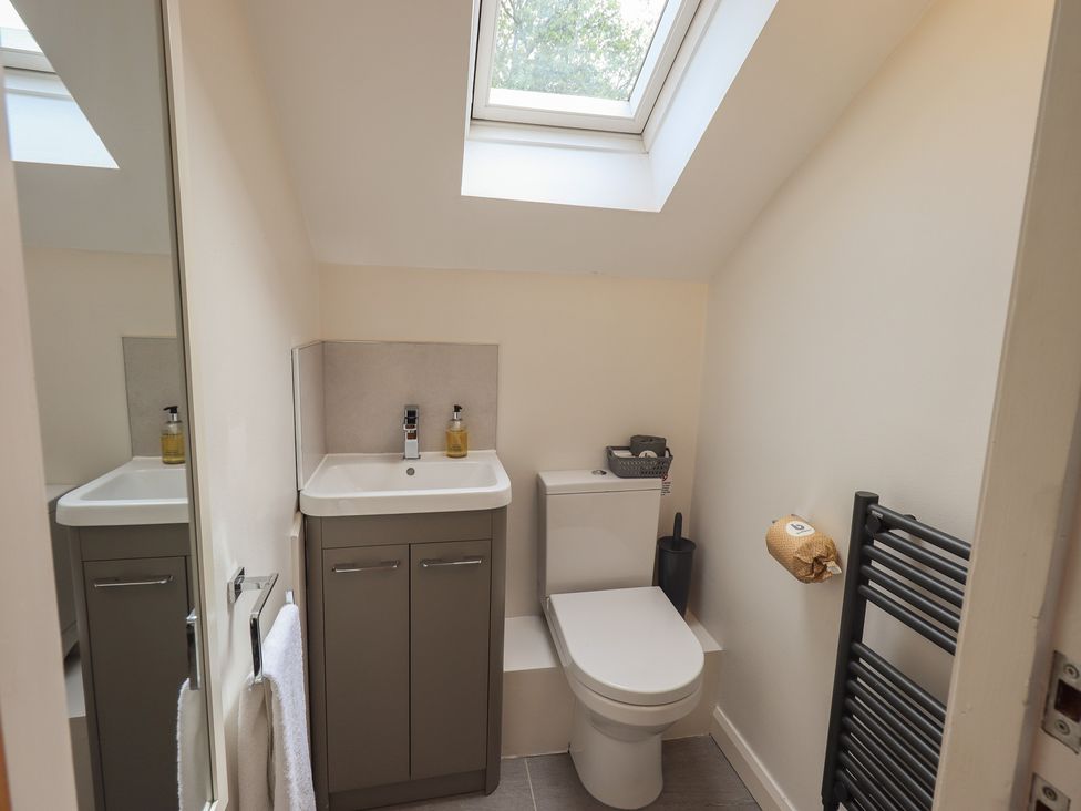 A bathroom with a sink and toilet at Yew - Woodland Cottages Bowness-On-Windermere