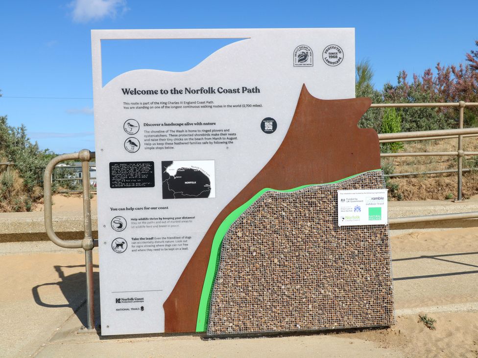 An information sign about the Norfolk Coast Path at Fern Cottage in Heacham