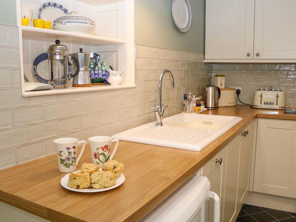 A kitchen with a sink and countertop at Brookside Barn in Bradwell