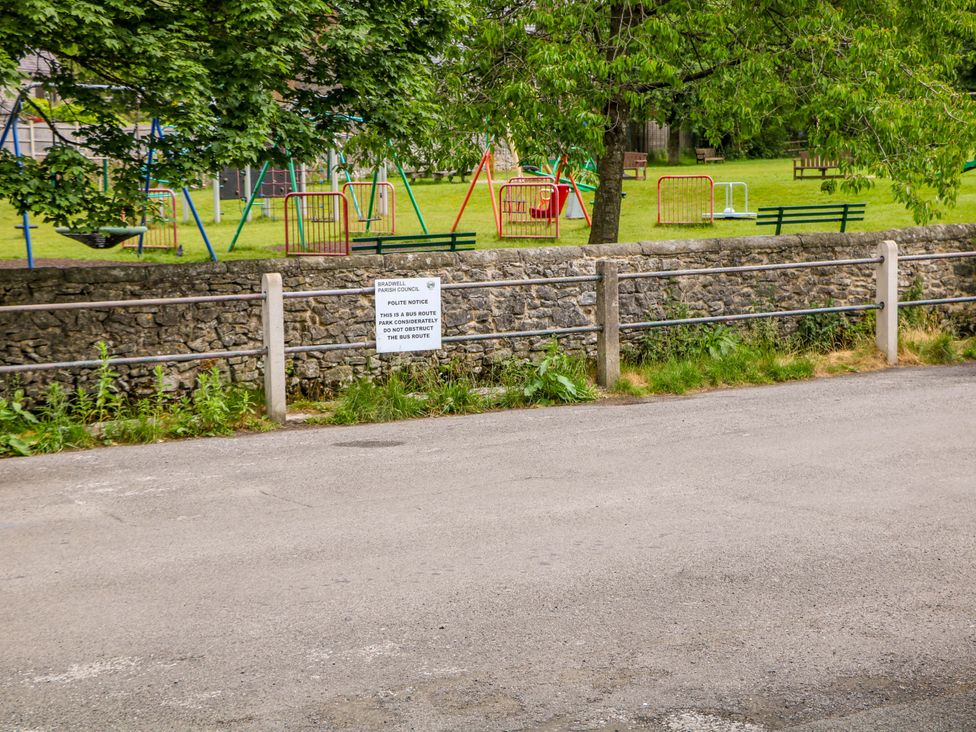 A playground with swings and benches in Bradwell