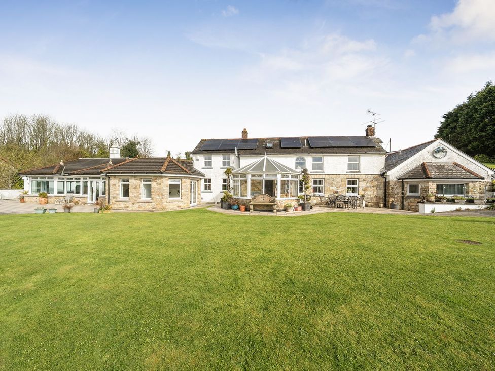 An outdoor view of a house with a garden at Chapel Green Studio Polgooth near St Austell