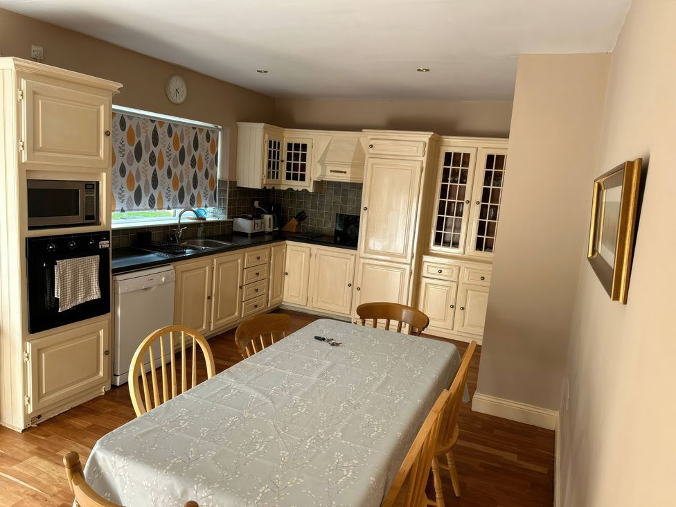 A kitchen with a dining table and chairs at The Sanctuary in Killavullen near Mallow