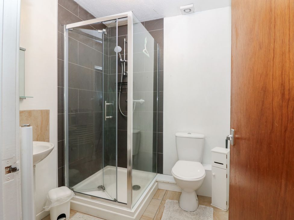 A bathroom with a shower, toilet, and sink at Alt na Voir in Tomintoul