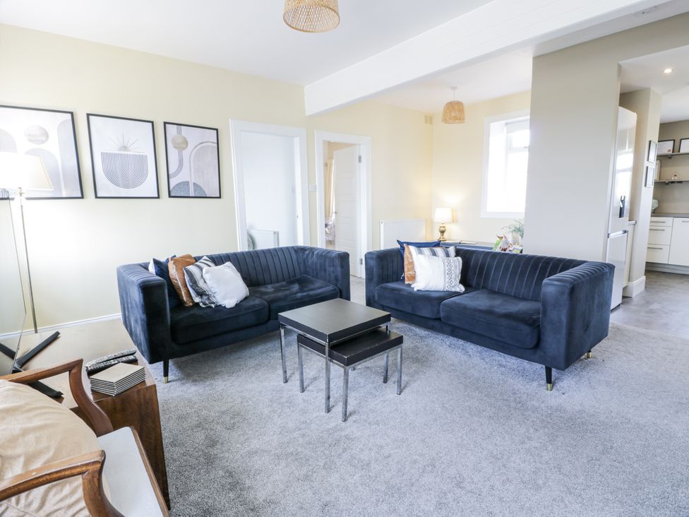 A living room with sofas and a table at Ailsa Shores in Turnberry