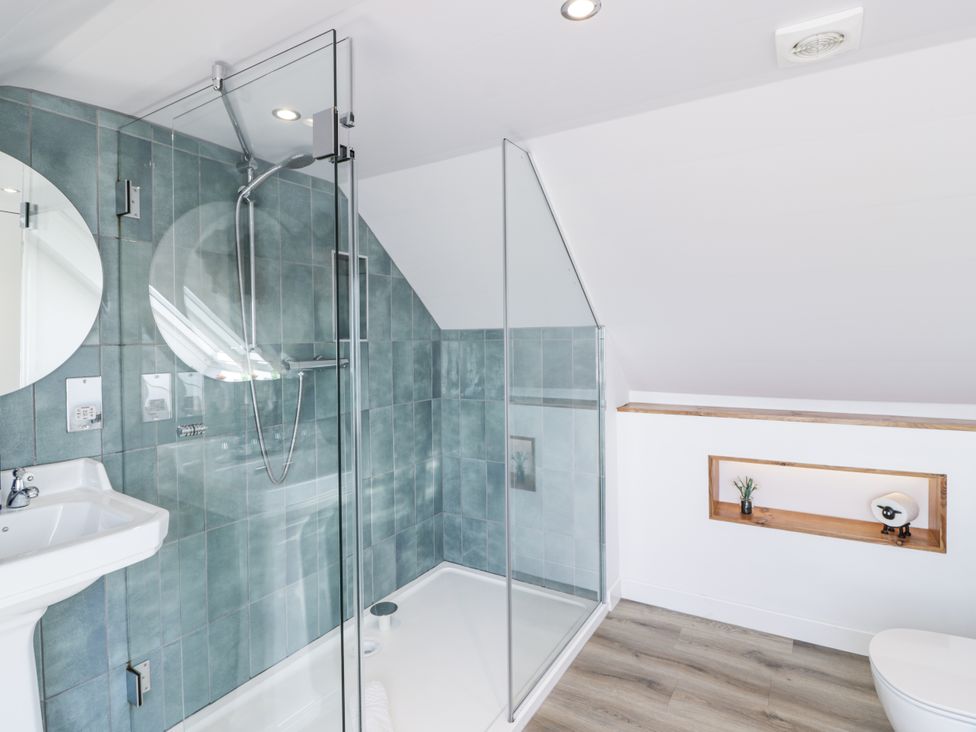 A bathroom with a shower and sink at Ailsa Shores in Turnberry