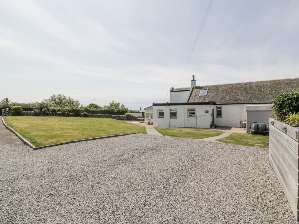 A house with a garden and gravel area at Ailsa Shores in Turnberry